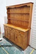 20th century pine dresser of two shelves over rectangular base, three short drawers over three