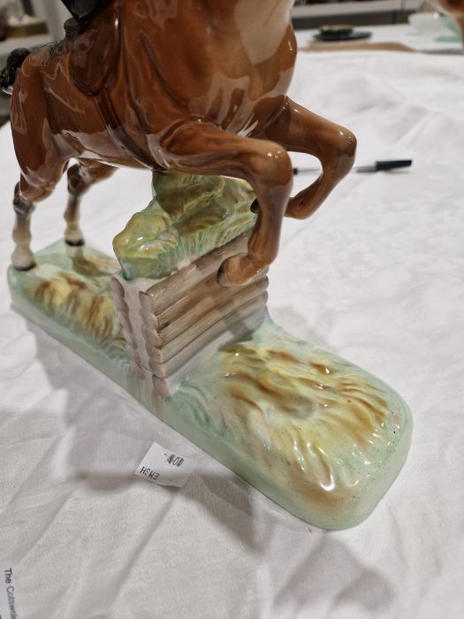 Beswick pottery model of a horse and rider jumping a fence, printed black marks, the female rider - Image 13 of 17