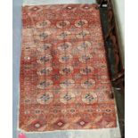 Turkoman Tekke red ground rug with three rows of seven quartered elephant foot guls, multiple