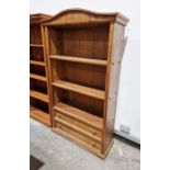 20th century walnut three-tier open bookcase with pair of drawers below, 108cm wide