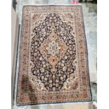 Eastern style red ground rug with central floral medallion on floral field, herati border flanked by