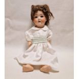 Heubach bisque headed doll with sleeping blue eyes and moulded composition body, 59cm