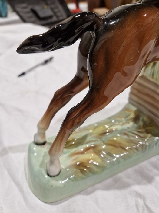 Beswick pottery model of a horse and rider jumping a fence, printed black marks, the female rider - Image 9 of 17