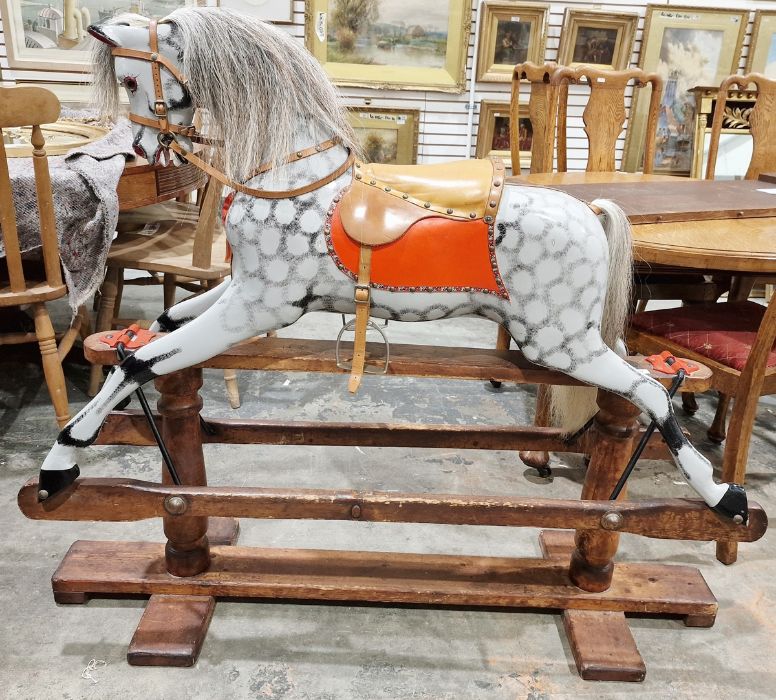 Antique rocking horse on wooden base, dappled grey with tan leather seat, 111cm high approx.