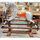 Antique rocking horse on wooden base, dappled grey with tan leather seat, 111cm high approx.
