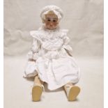 German doll with bisque head, sleeping blue eyes, open mouth and teeth, stuffed legs and body in a