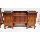 20th century mahogany sideboard with gadrooned carved borders, two panelled cupboard doors below two