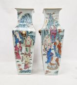 Pair Chinese porcelain tall vases of square tapering form, painted with figures in landscape in