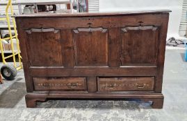 Antique oak mule chest with lift-up lid, having three shaped framed panels to the front, two drawers