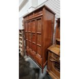 20th century walnut Oriental-style cabinet with folding panelled doors, three drawers to base