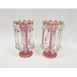 Pair of early 20th century pink glass lustres decorated with gilt banding, 22cm high (2)