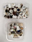 Two boxes of assorted thimbles to include some with images of the Seven Dwarfs from Snow White and