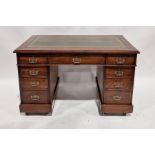 Late 19th/early 20th century mahogany pedestal desk inset green leather top, with an arrangement
