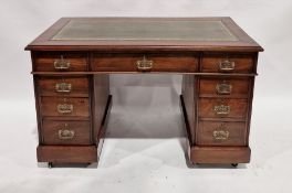 Late 19th/early 20th century mahogany pedestal desk inset green leather top, with an arrangement