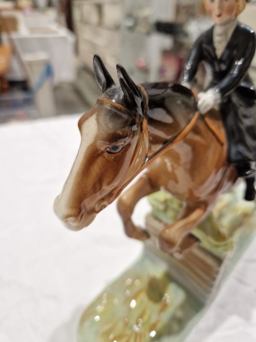 Beswick pottery model of a horse and rider jumping a fence, printed black marks, the female rider - Image 3 of 17