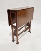 Early 20th century oak inlaid drop-leaf table with pierced stretchered base, on square feet and