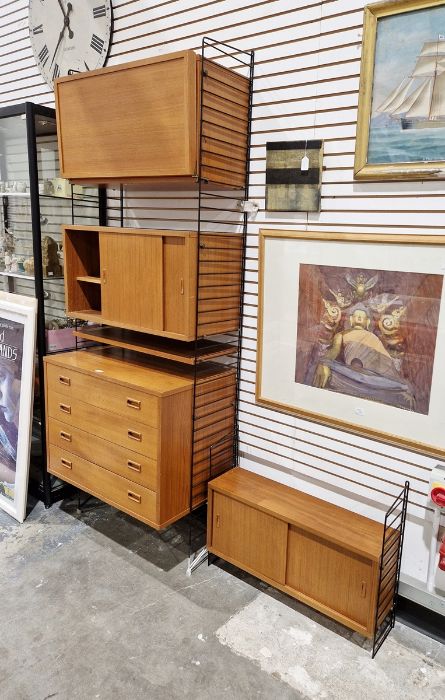 Swedish string wall hanging shelving unit comprising of cupboards and chest of four drawers