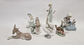 Six Lladro figures, printed blue marks, impressed numerals comprising two birds perched on flowering