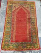Eastern wool madder ground arched niche rug with multiple floral and geometric borders 185cm x