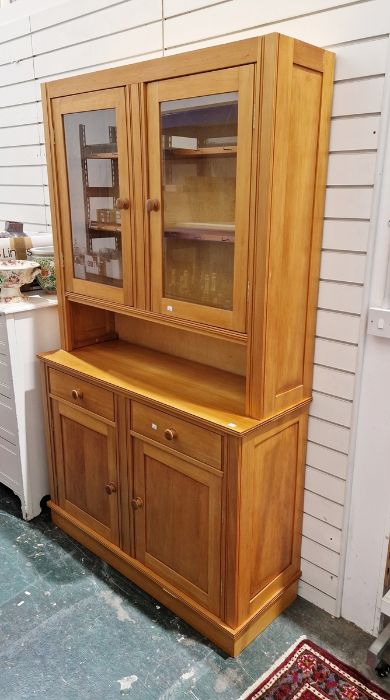 Late 20th century pine glazed dresser with shelf above two drawers and cupboards below, on plinth