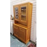 Late 20th century pine glazed dresser with shelf above two drawers and cupboards below, on plinth