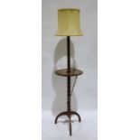 Early 20th century turned oak standard lamp with central tier on tripod base
