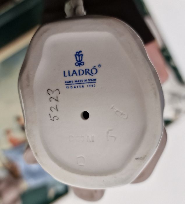 Five Lladro figures including a boy and girl riding a donkey, a pair of girls with baskets of - Image 6 of 10