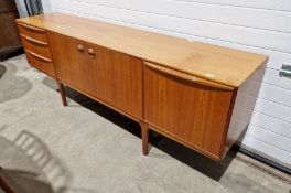 McIntosh teak sideboard with three cupboards and three drawers, on straight supports
