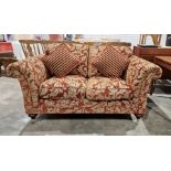 20th century red damask two-seater sofa on turned supports and castors