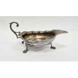 Early 20th century silver sauceboat, shallow with shaped edge, on three claw feet, Sheffield 1904,