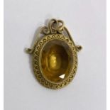 Gold (unmarked) oval pendant set with oval citrine-coloured stone, 3cm approx., 6.5g total approx.