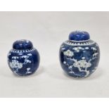 Two Chinese blue and white prunus decorated lidded ginger jars, each with double-ring mark to base
