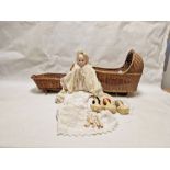 Bisque headed doll with fixed blue glass eyes, in christening robe and cream wool cape, three