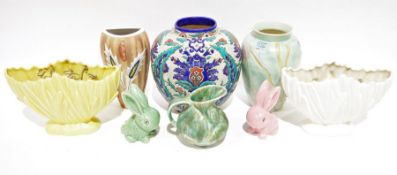 Cream Sylvac flower vase, a similar one in yellow, a Sylvac small green rabbit and a pink one, an
