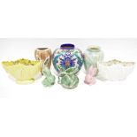 Cream Sylvac flower vase, a similar one in yellow, a Sylvac small green rabbit and a pink one, an