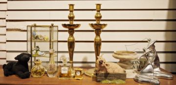Pair of brass candlesticks, a small glass display box, various collectables, two trophies labelled