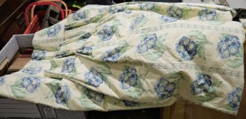 Pair of chintz curtains showing blue primula on a pale yellow ground and another pair with a blue