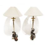 Pair of silver coloured metal table lamps with cream shades, modern