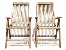 Four teak folding garden chairs