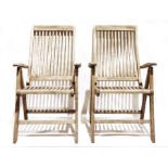 Four teak folding garden chairs