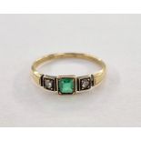 Gold-coloured metal, emerald and diamond ring set square emerald flanked by two old-cut diamonds,