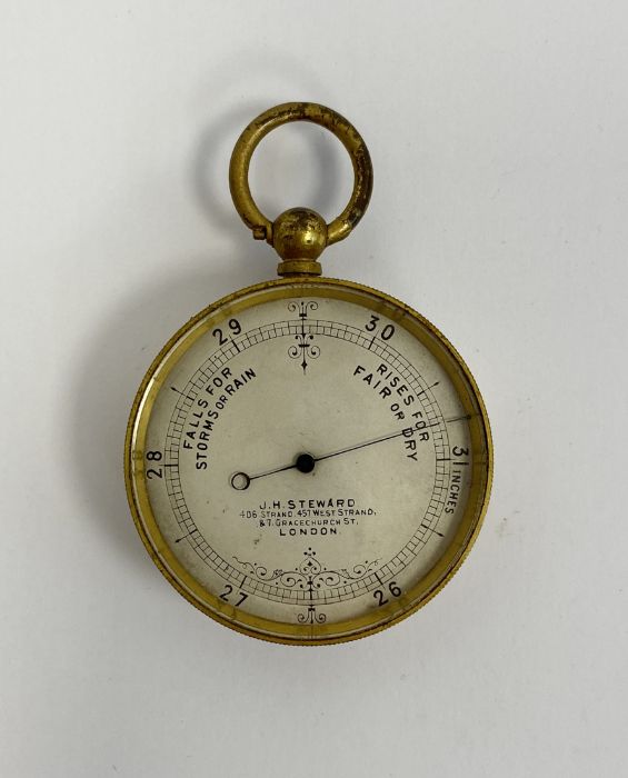 Late 19th century gilt-metal pocket barometer produced by J. H. Steward of London, 4.7cm diameter