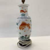 Chinese porcelain vase table lamp of slender ovoid form and painted with cart, in iron red amongst