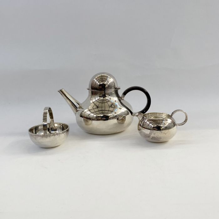 ROBERT RADFORD WELCH (1929-2000), Tea service - the tea pot with hinged domed lid and India rosewood