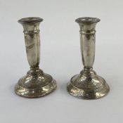 Pair of 1920's silver-mounted squat candlestick holders, Birmingham 1926, maker's mark worn, 12.