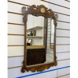 Chippendale-style gilt and mahogany wall mirror, having scroll pediment, with gilt shell decoration,