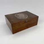 1930's walnut veneered cedar lined cigar/cigarette box, the lid with large oval plaque of the Arms