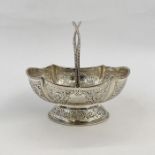 Victorian silver basket with twisted beaded handle, scalloped oval bowl with foliate scroll