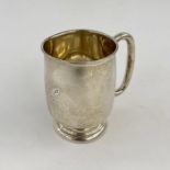 Silver Goldsmiths & Silversmiths tankard with foliate double scroll handle, London 1975,