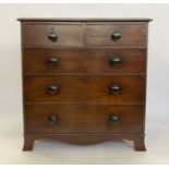 Victorian mahogany chest of two short and three long graduated drawers, with bun handles, on bracket